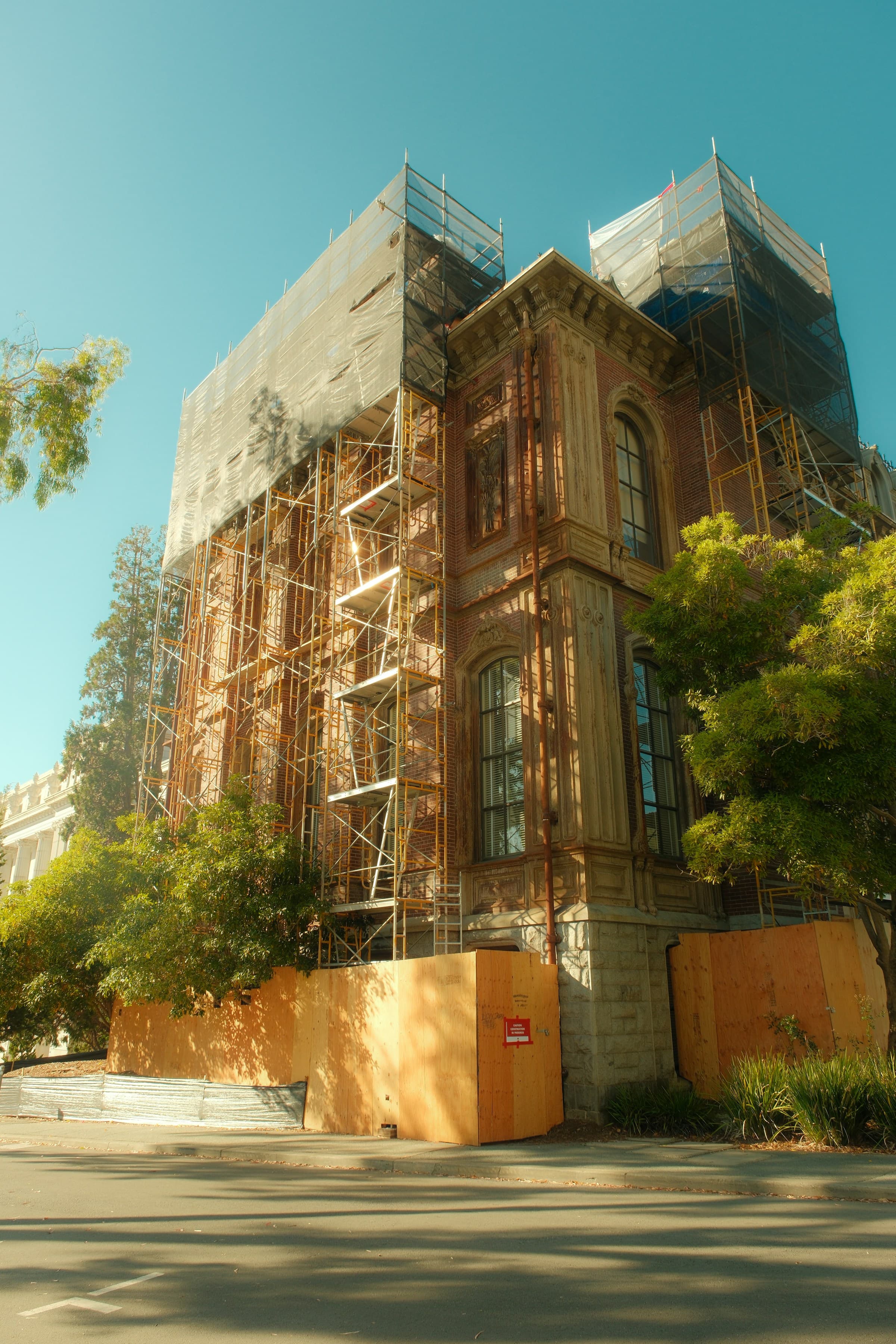 Historic building wrapped in scaffolding during active restoration